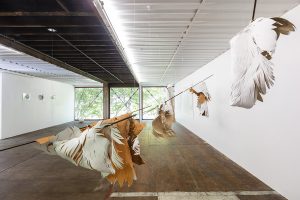 Angèle Guerre, artist, July 2019, “Souples, un souffle”, dimensions 5m x 3m.  Installation of metal, leather and incised paper. Sculpture created in situ for the exhibition ” Y Croître ” at the CACLB, Centre d’Art Contemporain du Luxembourg belge, Mautauban, Belgium. © photo J-P. Ruelle 