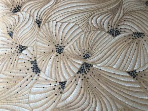 Mathilde Jonquière, mosaic artist, july 2019, Effloraison fresco, Jacques Semer store, Paris. This fresco, created like a Japanese woodblock landscape by the subtle overlay of scales, suggests a moving deep nature, revealing the floral world of Jacques Semer. 
