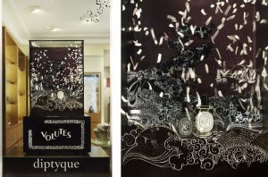 This decor is dedicated to showcase the new Volute perfume, an oriental and woody fragrance. Based on the memories of a boat trip to Saigon by Yves Coueslant, Volute mixes the waves’ foam, smoke rings and smoke from liners. This imaginary world evokes the peaceful and sober image of Diptyque itself: the black and white decor is animated by white confettis and extended to the glass windows by carved dot pattern. Three black candlesticks enlighten the three Volutes bottles.