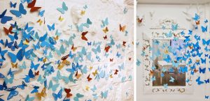 October 2018 –  POP-UP STORE – MOROCCANOIL. Composed of plumes and paper, the photocall of the event is covered with hundreds of butterflies in the color of the Color Complete line and of different shapes, that seem to escape. 