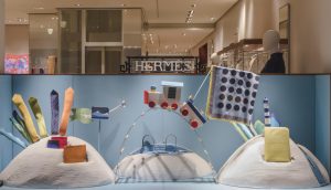 Soline d’Aboville, scenographer, January 2019, On hour way home from school, Hermès store, Genève. On our way home from school, we began to play on an enormous railway which whisked us away all over the World…