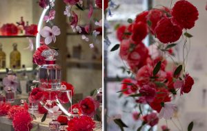 William Amor, upcycling artist, floral creation for the launching of Mon Guerlain, Bloom of Rose fragrance, March 2020. Guerlain windows of 68, Champs-Elysées store. These materials blossom into flowers in shades of intense red and pastel pink.