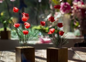 April 2019. GUILTLESS PLASTIC – Ro PRIZE – ROSSANA ORLANDI – Milan Design Week. Poppies on wooden base, height 20-25 cm 
