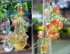 William Amor, upcycling artist, upcycled installation “Ondée messagère”, Passage du Havre, June 2025, Paris. These botanical sculptures curl around the glass drops, the artist composes vegetal creations in tribute to the abundant nature of tropical regions, birthplace of life. 